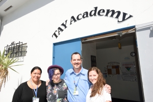 Staff of the San Diego Youth Services TAY Academy welcome all Transition Age Youth (TAY) to drop-in. Left to right: Vanessa Arteaga, Indie Landrum, Stephen Carroll, and Gillian Leal.